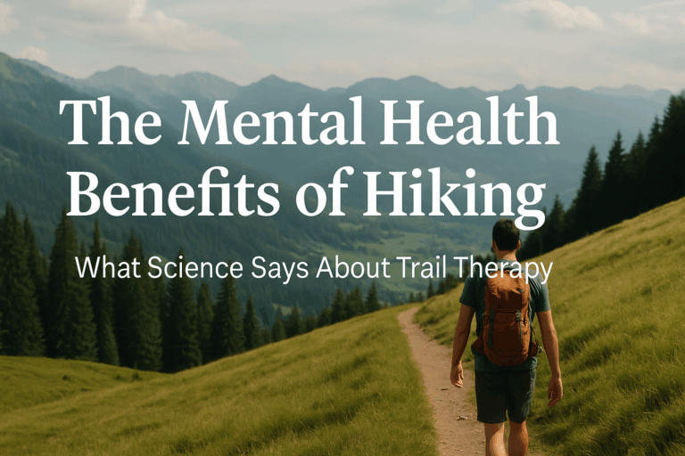 A hiker walks along a grassy mountain trail surrounded by trees and ridgelines, with image text reading "The Mental Health Benefits of Hiking."